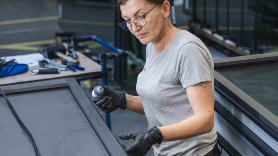GIG employee completing a façade element in production.