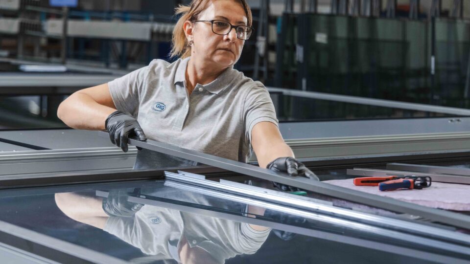 GIG employee in element fabrication mounting cover shells.