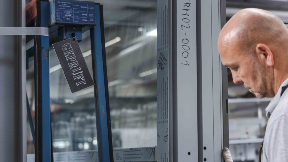 A façade element is stored on returnable pallets after quality inspection and packed for international shipping.