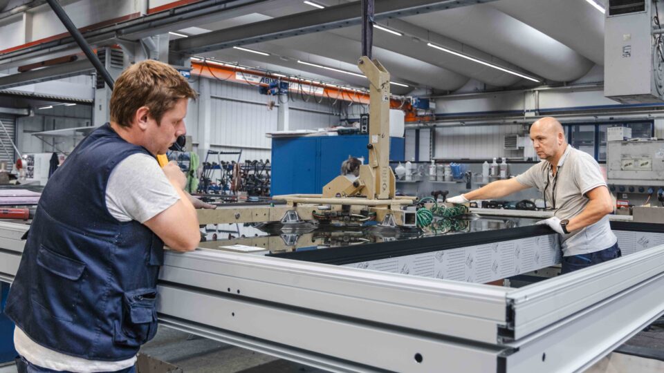 Element façade is being glazed in production.